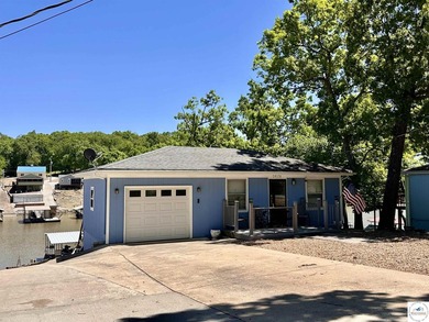 Located on a quiet cove on the Lake of the Ozarks in a very - photo 31
