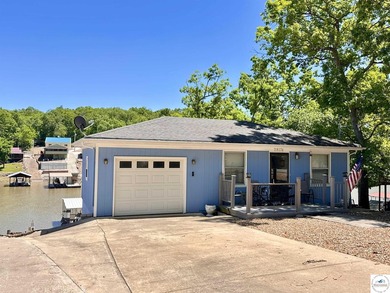 Located on a quiet cove on the Lake of the Ozarks in a very - photo 32