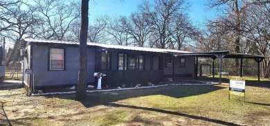 Lake Home For Sale in Log Cabin, Texas