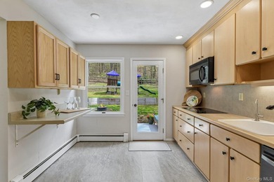 Set on a full acre and surrounded by mature trees and lush - photo 12