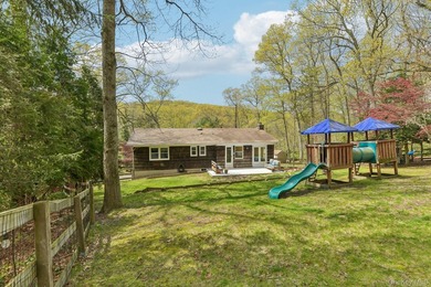 Set on a full acre and surrounded by mature trees and lush - photo 20