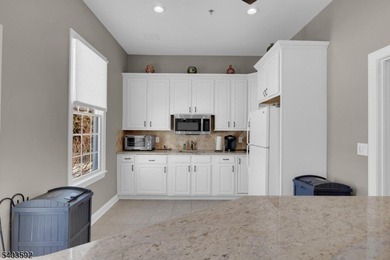 Enjoy effortless living in this desirable active adult community