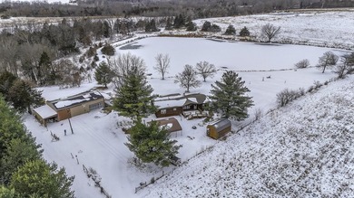 Hidden among mature trees and open acreage, this maintained