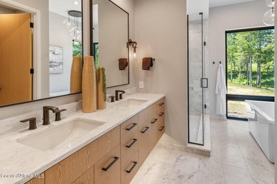 Set against a serene stand of forest, this spacious residence - photo 14