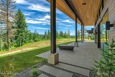 Set against a serene stand of forest, this spacious residence - photo 17