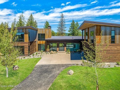 Set against a serene stand of forest, this spacious residence - photo 18