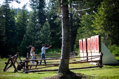 Set against a serene stand of forest, this spacious residence - photo 45