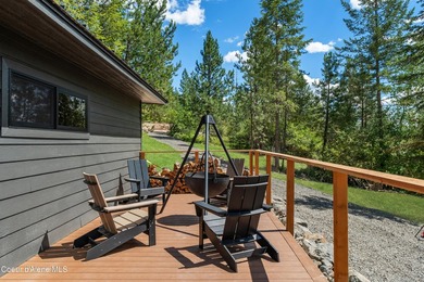 Set against a serene stand of forest, this spacious residence - photo 46