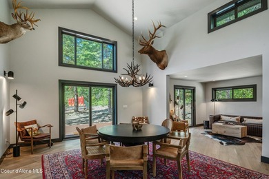 Set against a serene stand of forest, this spacious residence - photo 47