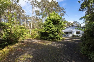 Nestled among lush hapuu ferns, majestic Ohia Lehua trees, and - photo 1