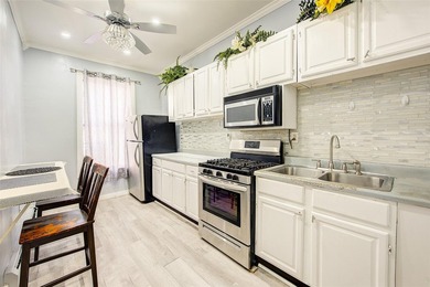 This stunning and meticulously maintained all-brick two-family - photo 31