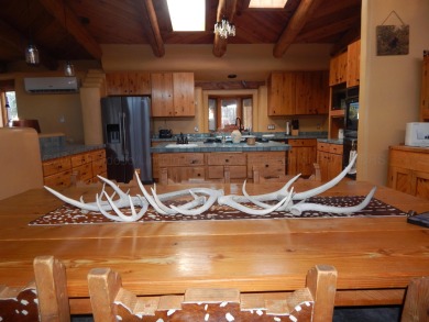 True Adobe style home in prestigious Alto Lakes Golf and Country