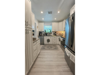 This spacious single-family home offers nearly 2,400 sq ft of - photo 5