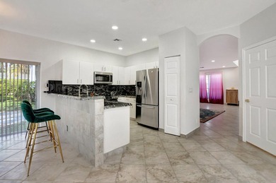 Welcome to 7363 Panache Way at Boca Pointe! This remodeled 4