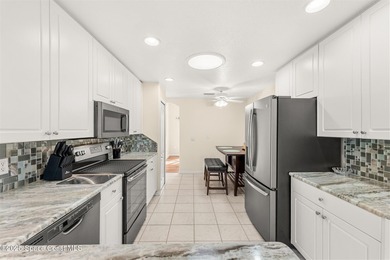 Discover serene lakeside living in this inviting 4-bedroom - photo 21