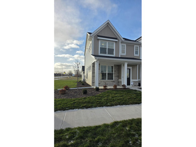 Enjoy the New Year in this move-in-ready end-unit Adler townhome