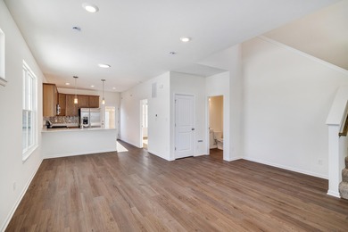 Enjoy the New Year in this move-in-ready end-unit Adler townhome