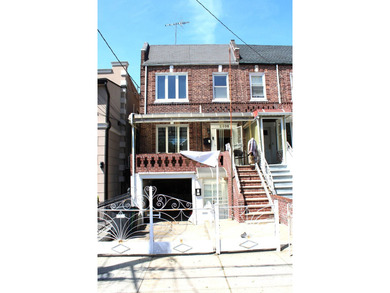 FOR SALE Beautiful & Versatile 3-Family Brick Home in Prime Bath - photo 1
