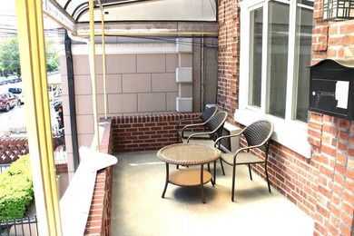 FOR SALE Beautiful & Versatile 3-Family Brick Home in Prime Bath - photo 3
