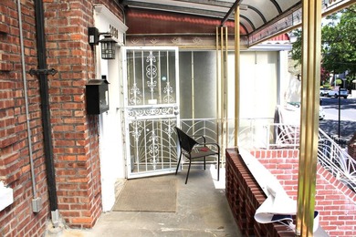 FOR SALE Beautiful & Versatile 3-Family Brick Home in Prime Bath - photo 4