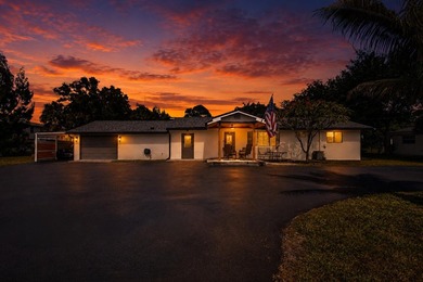 Situated on a rare, oversized lot with serene pond views, this - photo 1