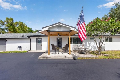 Situated on a rare, oversized lot with serene pond views, this - photo 2
