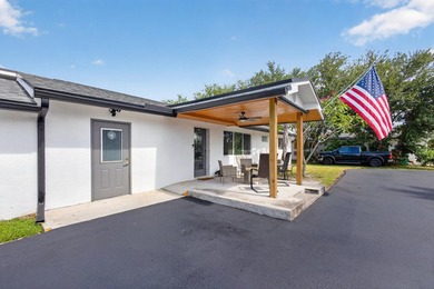 Situated on a rare, oversized lot with serene pond views, this - photo 3