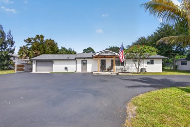 Situated on a rare, oversized lot with serene pond views, this - photo 4