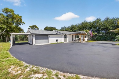 Situated on a rare, oversized lot with serene pond views, this - photo 6