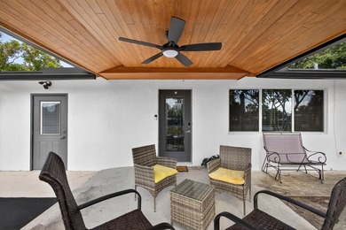 Situated on a rare, oversized lot with serene pond views, this - photo 9