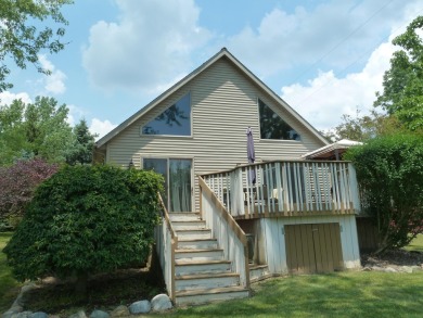 Lovely energy efficient Chalet on a channel at Lake Diane - Lake Home For Sale in Camden, Michigan