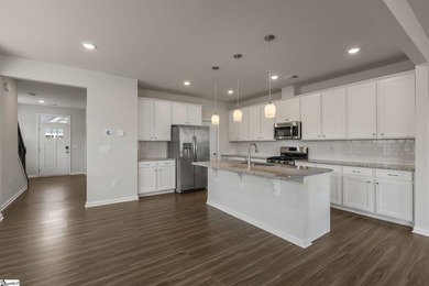 Built in 2023, this beautifully maintained end-unit townhome in - photo 12