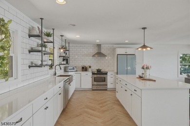 Welcome to this beautifully renovated lakefront retreat offering - photo 6