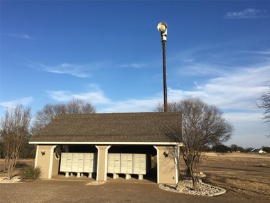 This property is on the new golf course, backs up to tee box # - photo 12
