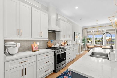 Look No Further! Tucked along the lakefront in the gated - photo 18