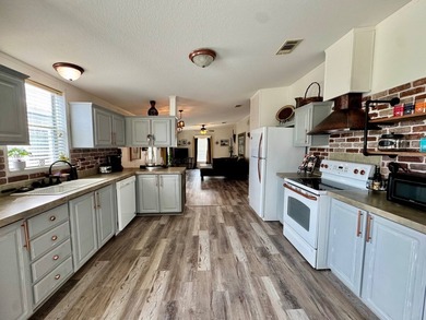 613 W. Lakeshore Drive, Cocoa, FL is a beautifully updated 2006 - photo 8