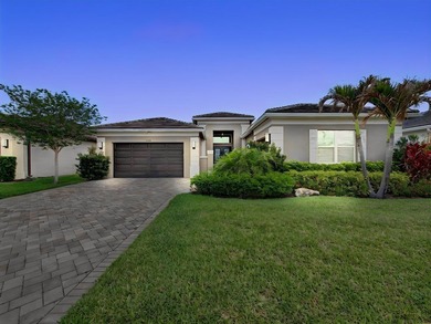 Experience elevated lakefront living in this exquisitely - photo 1