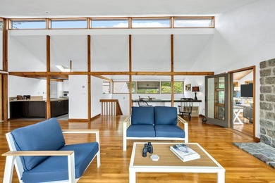 Set on over 3 private acres along the protected shores of - photo 18
