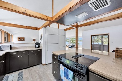 Set on over 3 private acres along the protected shores of - photo 26