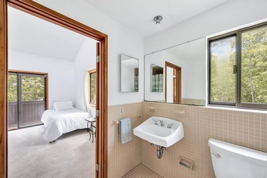 Set on over 3 private acres along the protected shores of - photo 32
