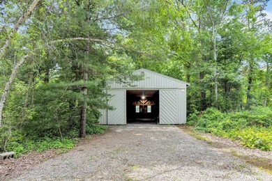 Set on over 3 private acres along the protected shores of - photo 45