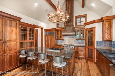 This classic mountain-style home features four bedrooms, each - photo 17