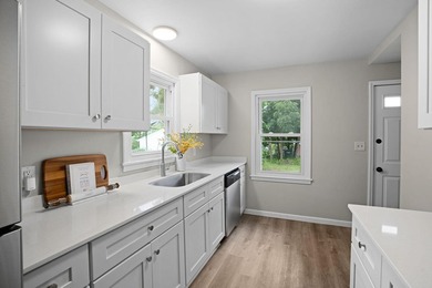 Fresh renovations and a thoughtful layout make this 3-bedroom - photo 15