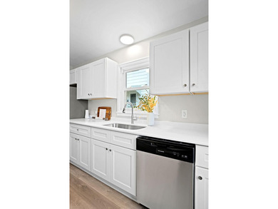 Fresh renovations and a thoughtful layout make this 3-bedroom - photo 17