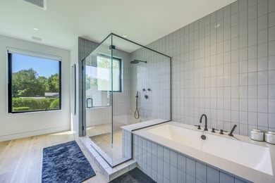 Newly built in 2022, this near-new, net-zero modern sanctuary in - photo 11