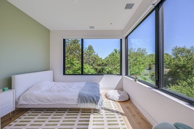 Newly built in 2022, this near-new, net-zero modern sanctuary in - photo 13
