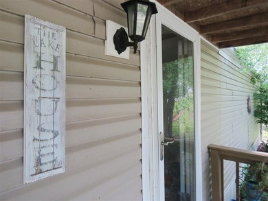 Step into a world of lakeside serenity with this stunning - photo 47