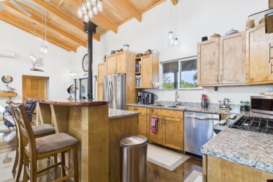 Escape to this 3BR/2BA country retreat on 12.9 acres m/l in