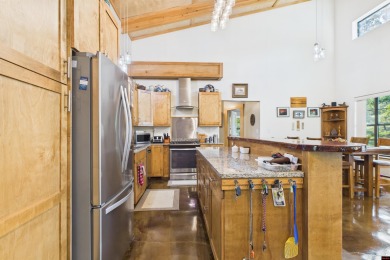 Escape to this 3BR/2BA country retreat on 12.9 acres m/l in