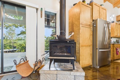 Escape to this 3BR/2BA country retreat on 12.9 acres m/l in